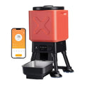 Red and black pet food dispenser with smartphone app interface on a white background